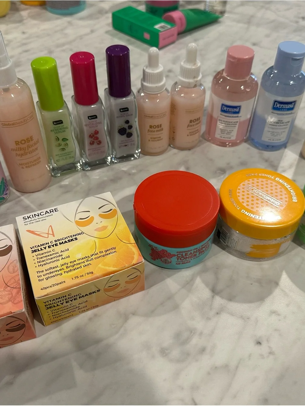 Bundle of facial toner pads, eye masks, and serums